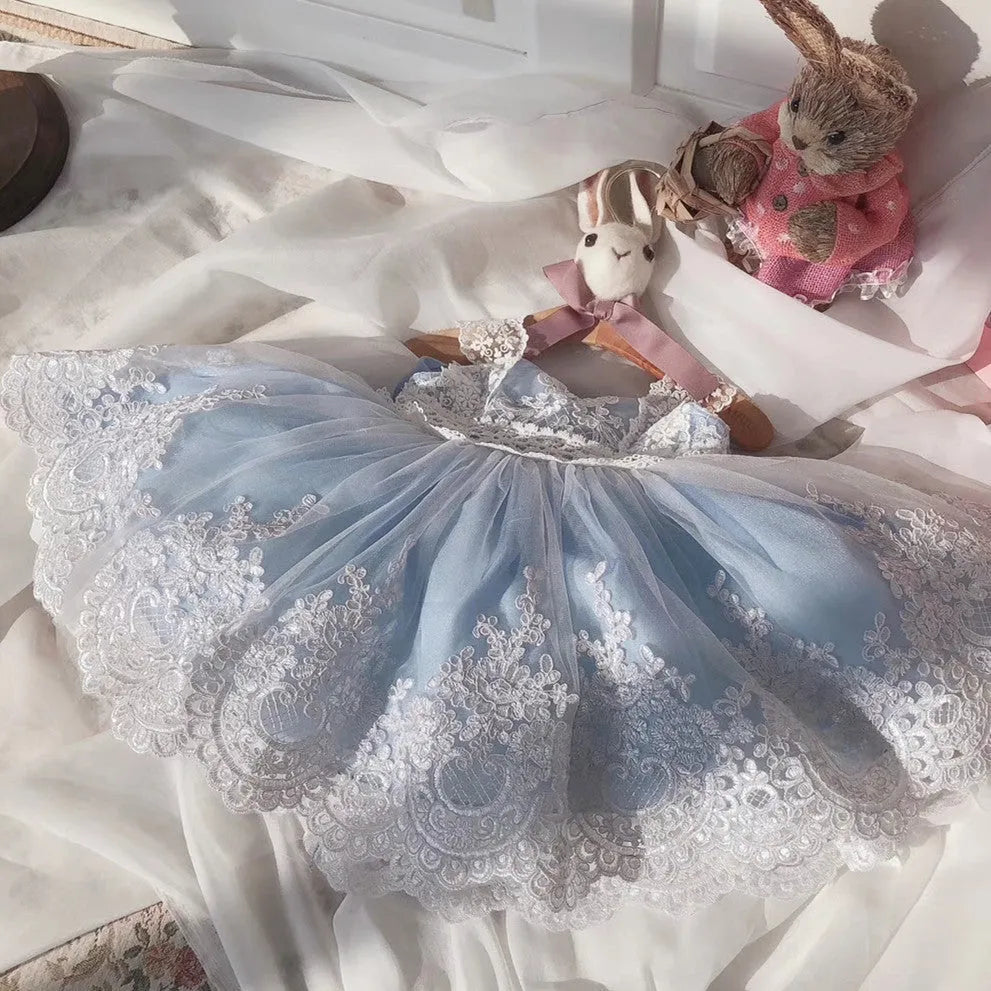 Ocean blue lace princess dress for baby girl on hanger showing lace detail