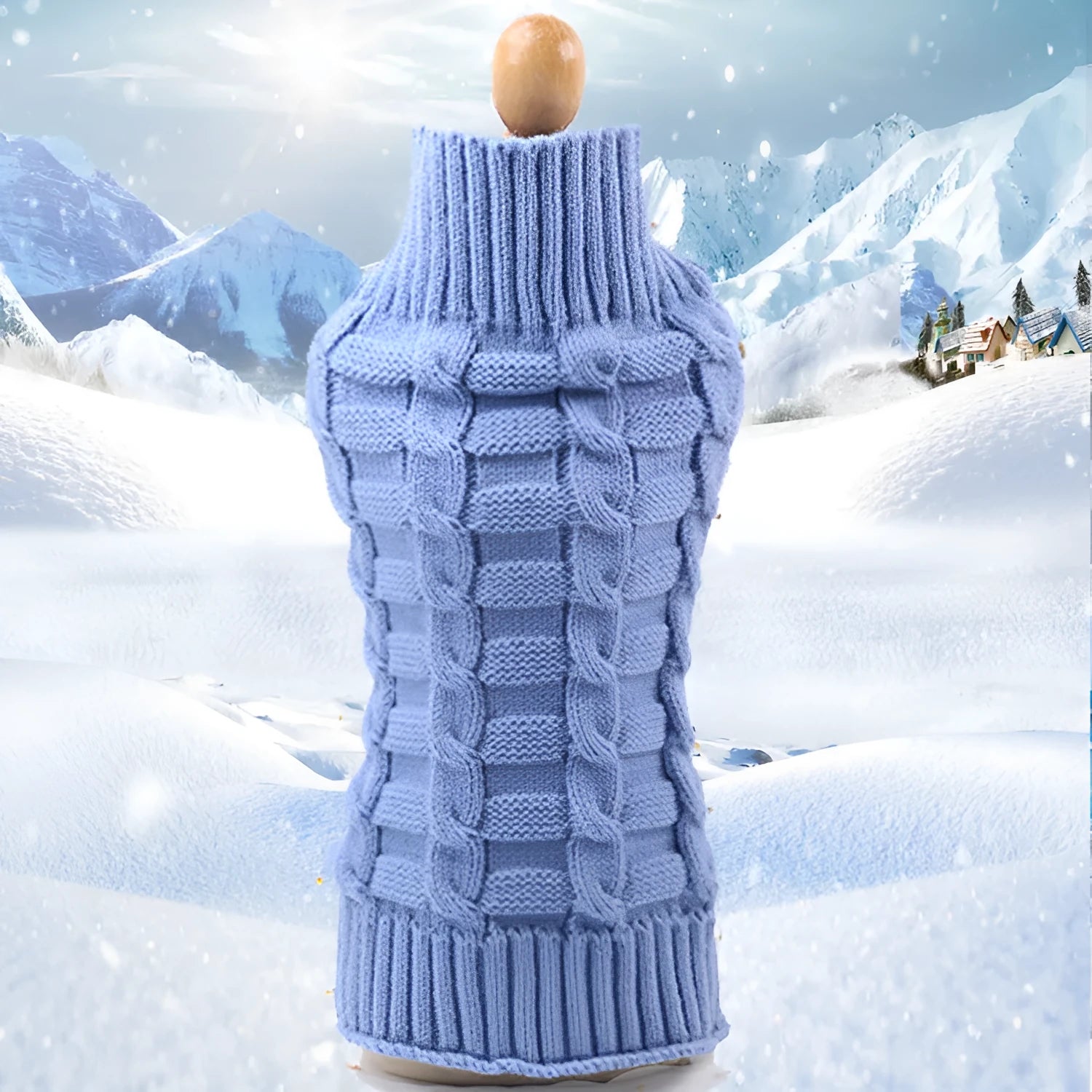 A dog wearing a blue twisted rope knit wool sweater, showing the cable texture and fit.