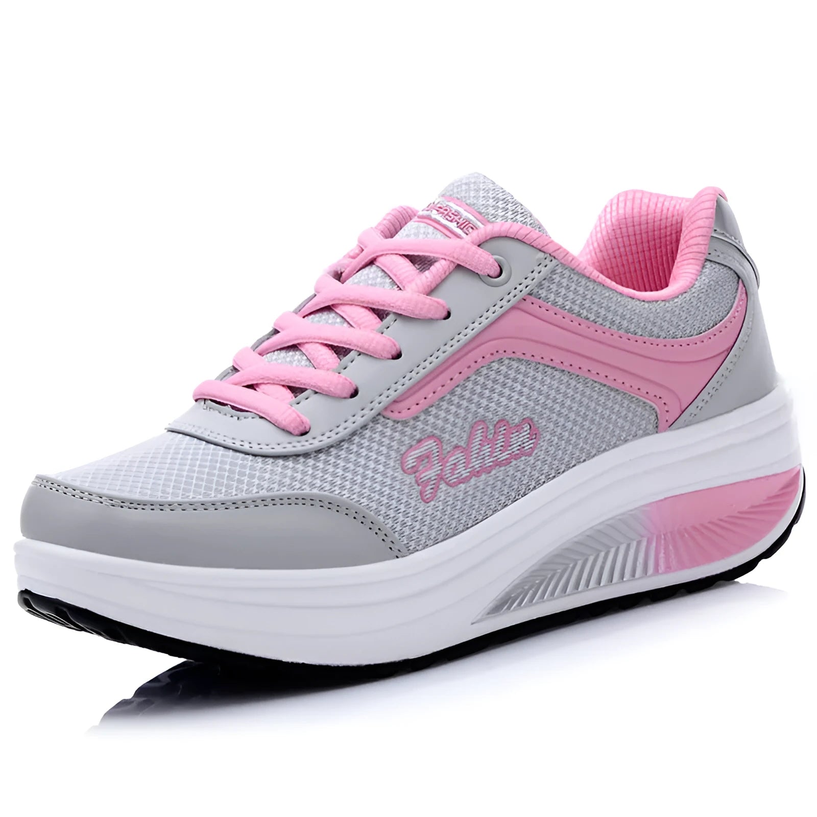 Women's grey pink mid-heel heelless sports travel shoes on a white background.
