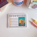 Kawaii bear memo pad open to a to-do list, paper cartoon notebook with bear design