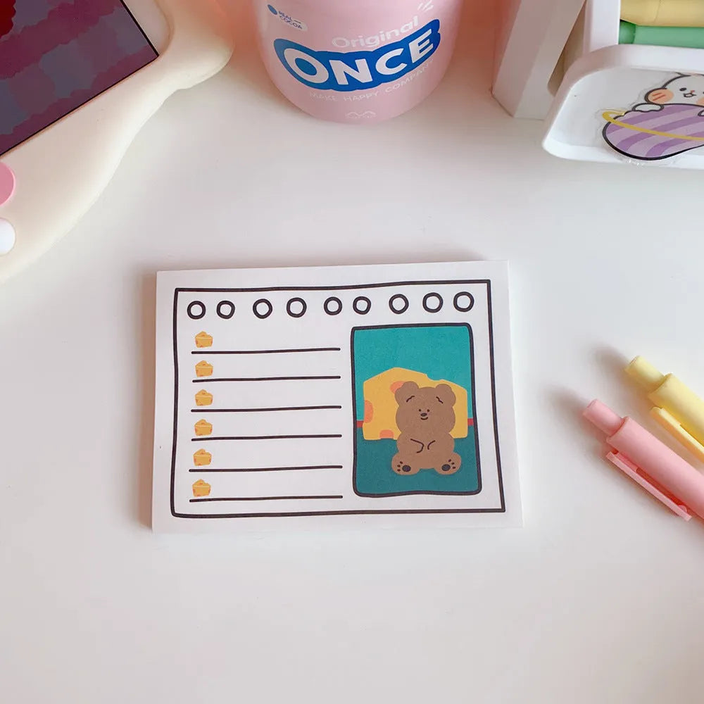 Kawaii bear memo pad open to a to-do list, paper cartoon notebook with bear design