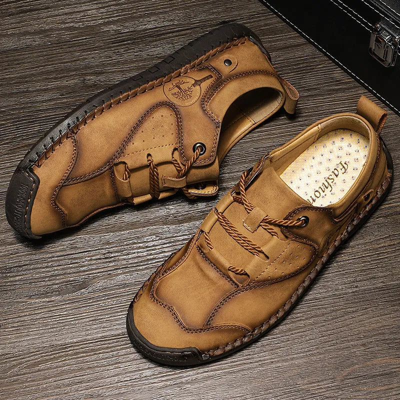 Men's black microfiber casual leather shoes with a round toe on a plain background.