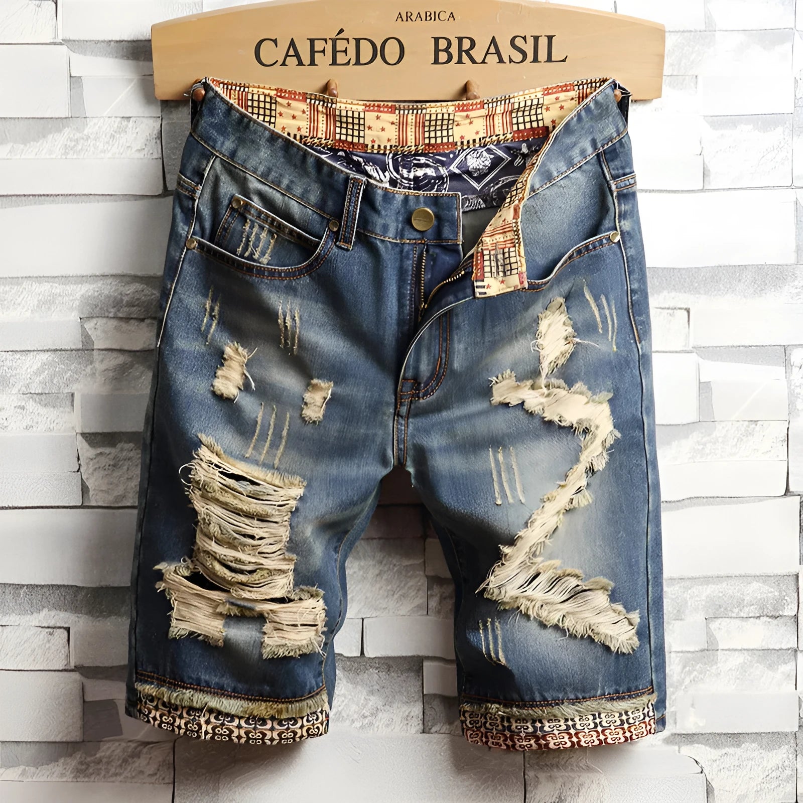 Men's big hole distressed denim Capri shorts in blue with straight leg and mid-rise waist
