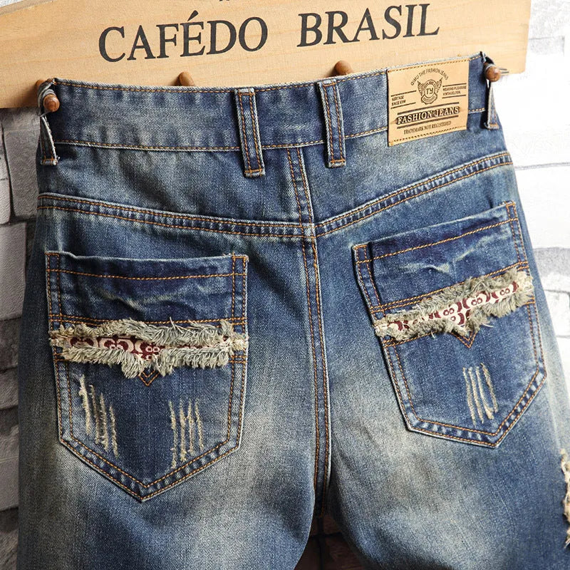 Men's big hole distressed denim Capri shorts in blue with straight leg and mid-rise waist