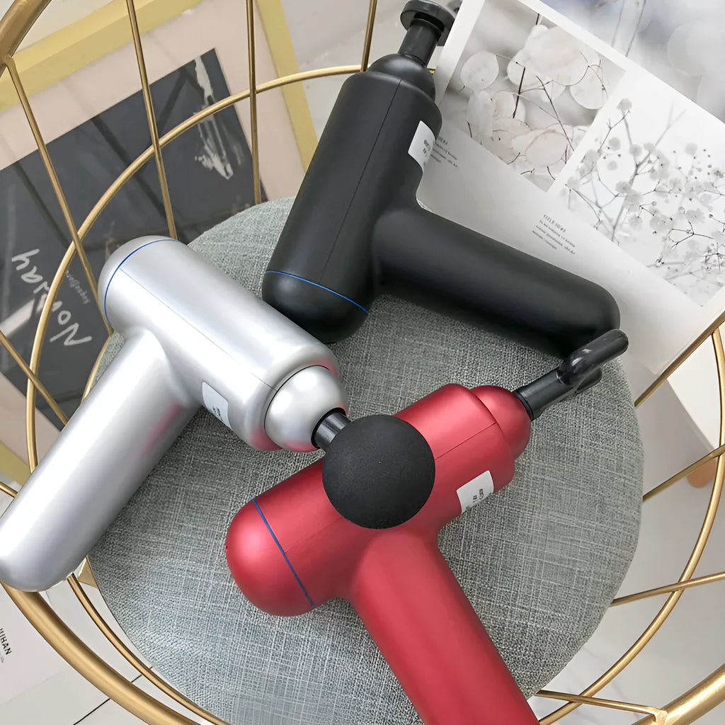 God Fascia Gun handheld percussion massager in black, red, or white colours with USB charging cable.