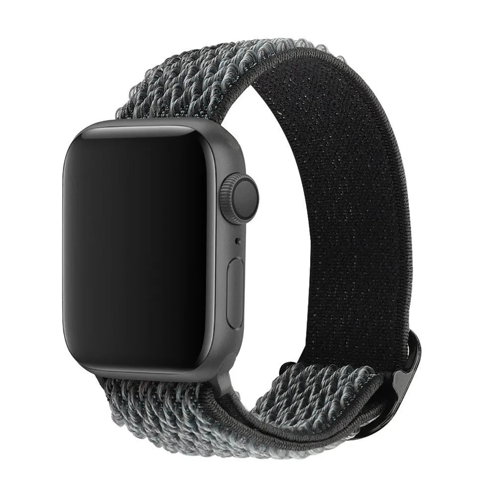 Braided elastic nylon Apple Watch strap in multiple colours on a grey background.