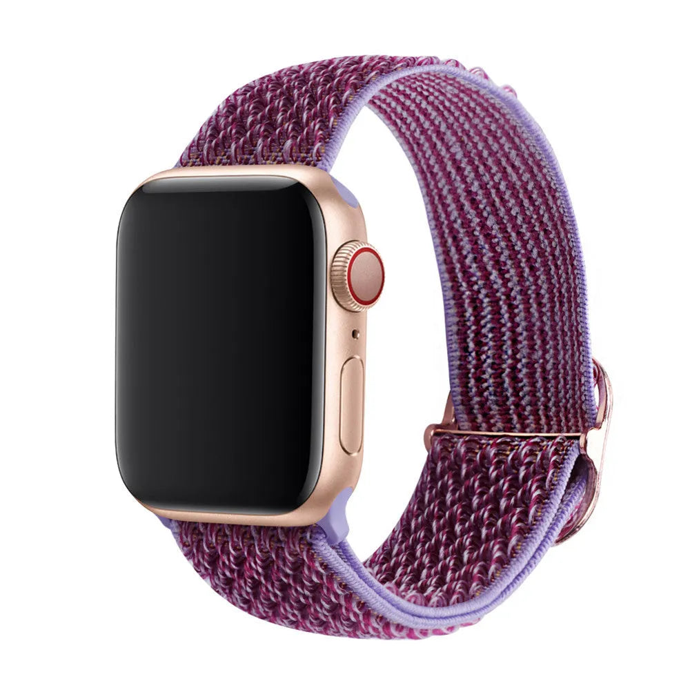 Braided elastic nylon Apple Watch strap in multiple colours on a grey background.