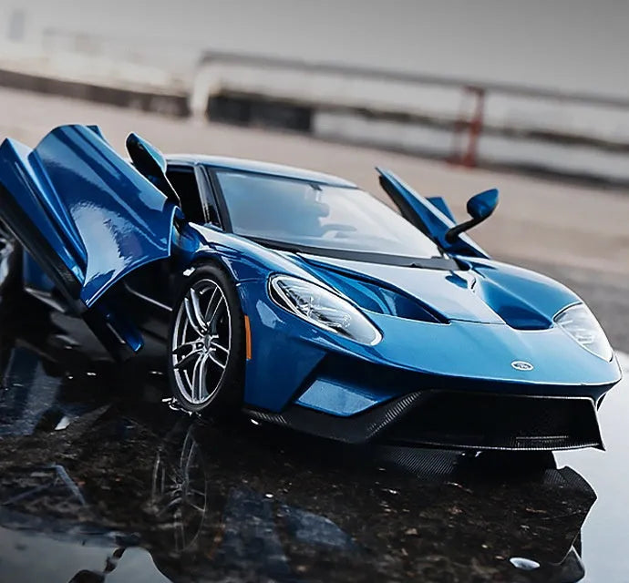 Blue 1:18 simulation alloy toy sports car model with force control on a flat surface