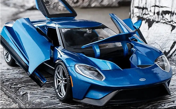 Blue 1:18 simulation alloy toy sports car model with force control on a flat surface