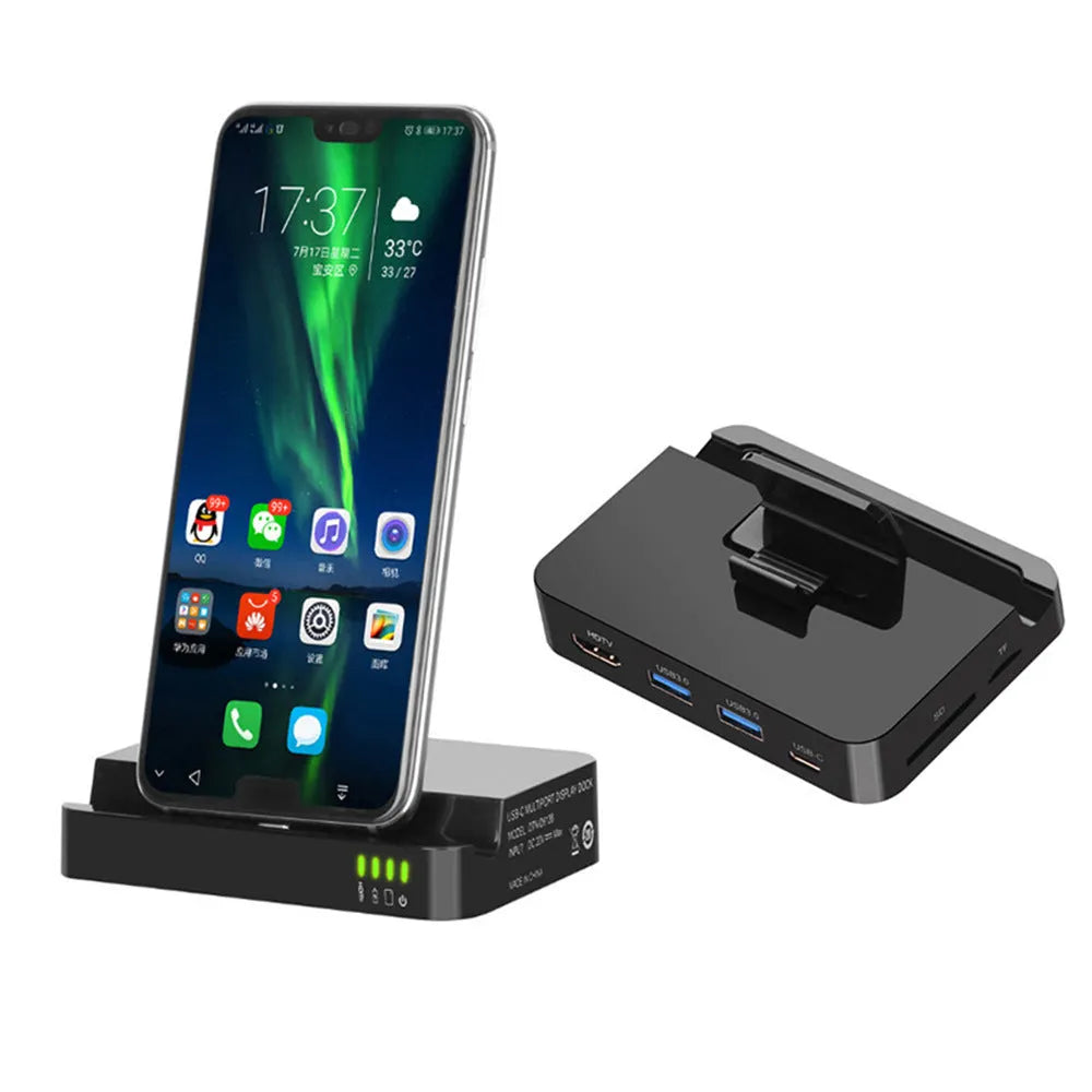 Black mobile phone to HD video converter dock on a wooden table, showing compact size and single black base design.