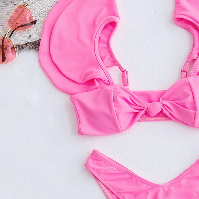 Pink women's 2 piece nylon bikini set with ruffle top and chest pads, available in S M L sizes