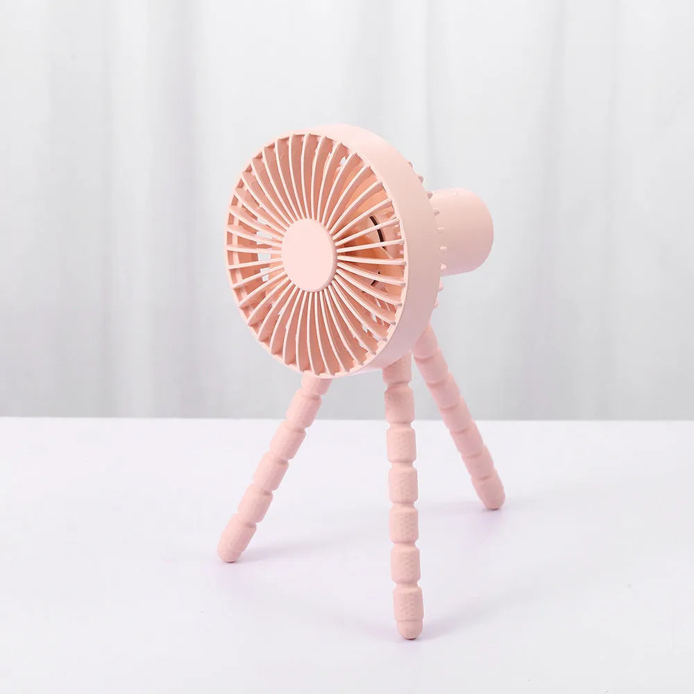 A small white USB desktop fan with an adjustable bending head on black octopus tripod legs.