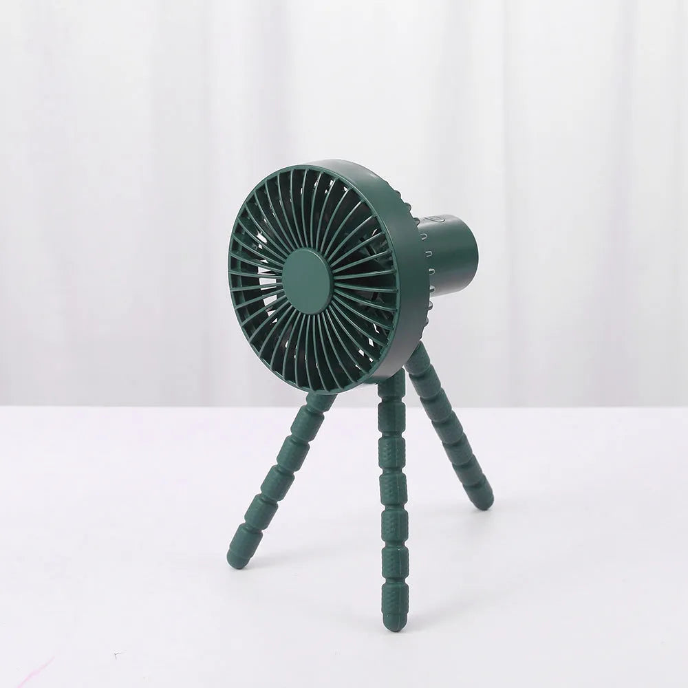 A small white USB desktop fan with an adjustable bending head on black octopus tripod legs.
