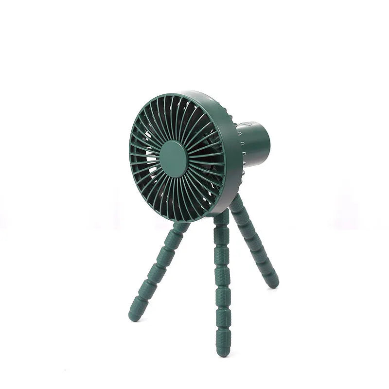 A small white USB desktop fan with an adjustable bending head on black octopus tripod legs.