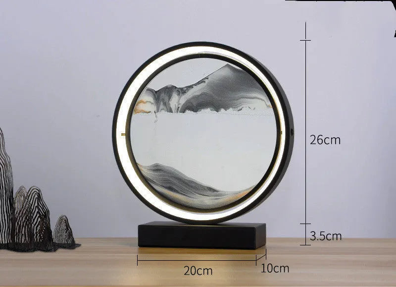 Small decorative glass table lamp with a simple modern design on a bedside table, showing a colourful mountain pattern