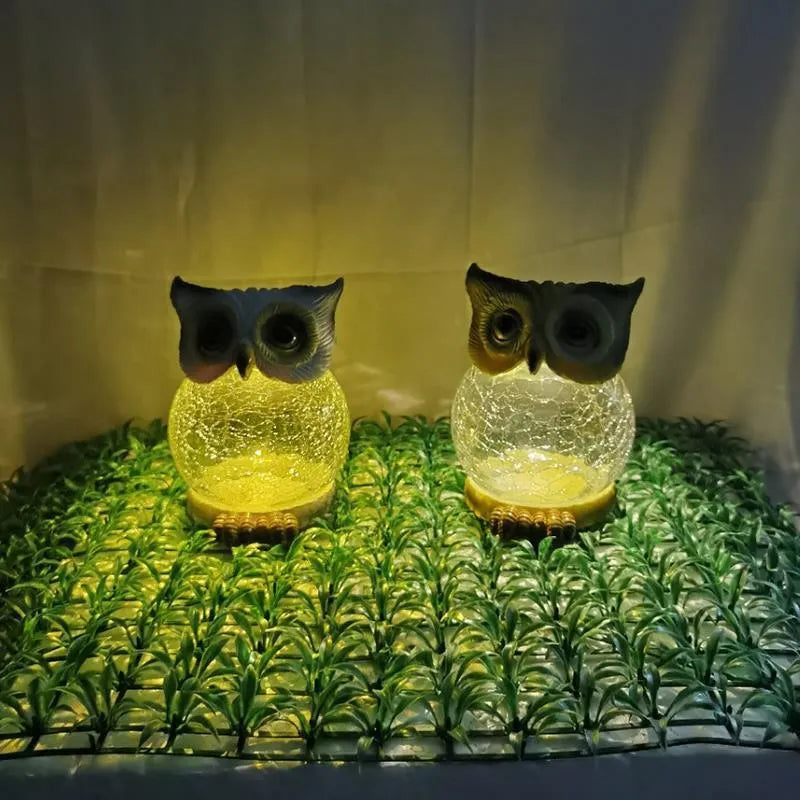 White solar owl garden light with LED illumination for outdoor pathways