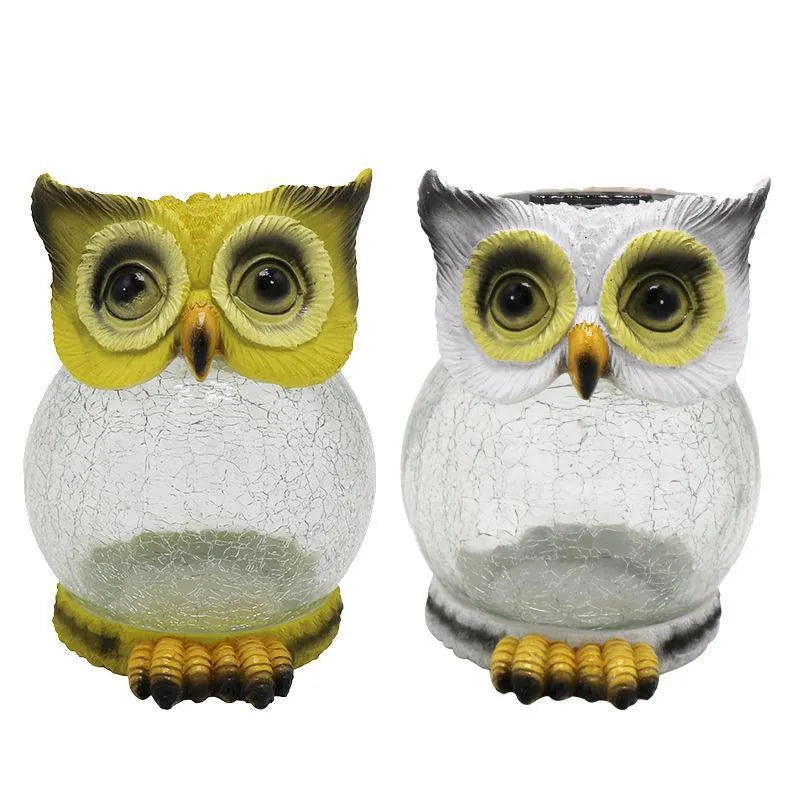 White solar owl garden light with LED illumination for outdoor pathways