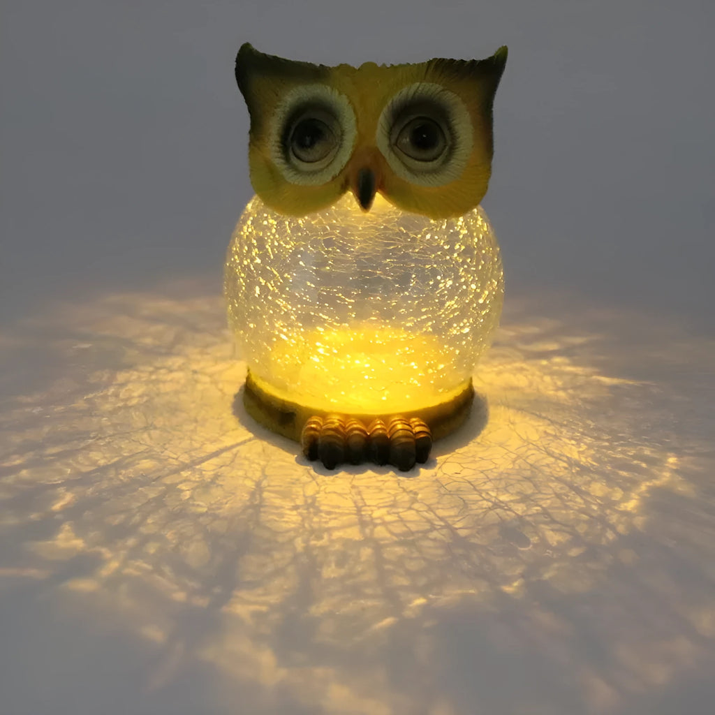 White solar owl garden light with LED illumination for outdoor pathways