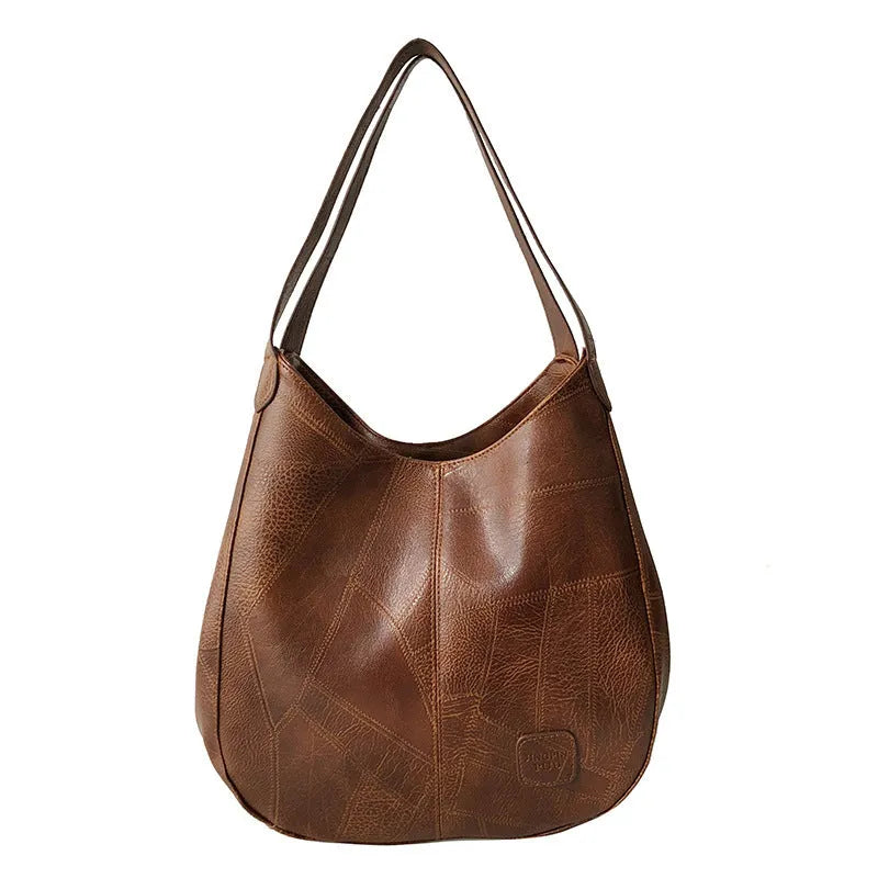 Vintage women's large PU shoulder tote bag in solid colour with double straps and magnetic buckle closure.