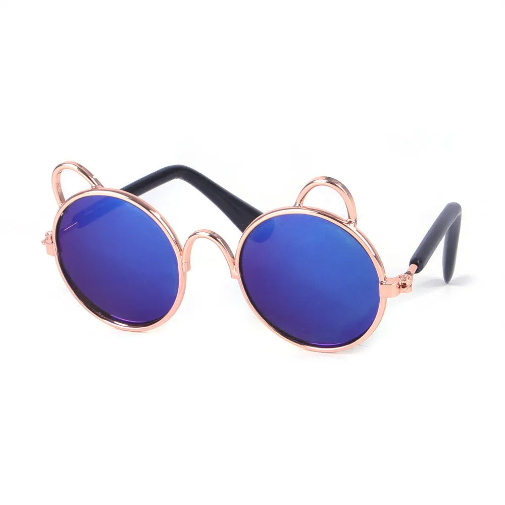 Cat wearing metal frame sunglasses in black with reflective lenses