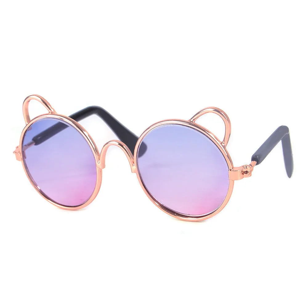 Cat wearing metal frame sunglasses in black with reflective lenses