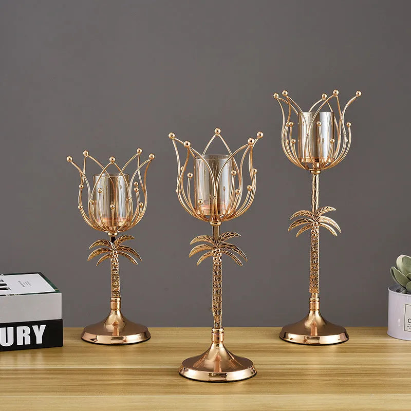 Gold iron candle holder on a dining table with a lit candle, three height options available