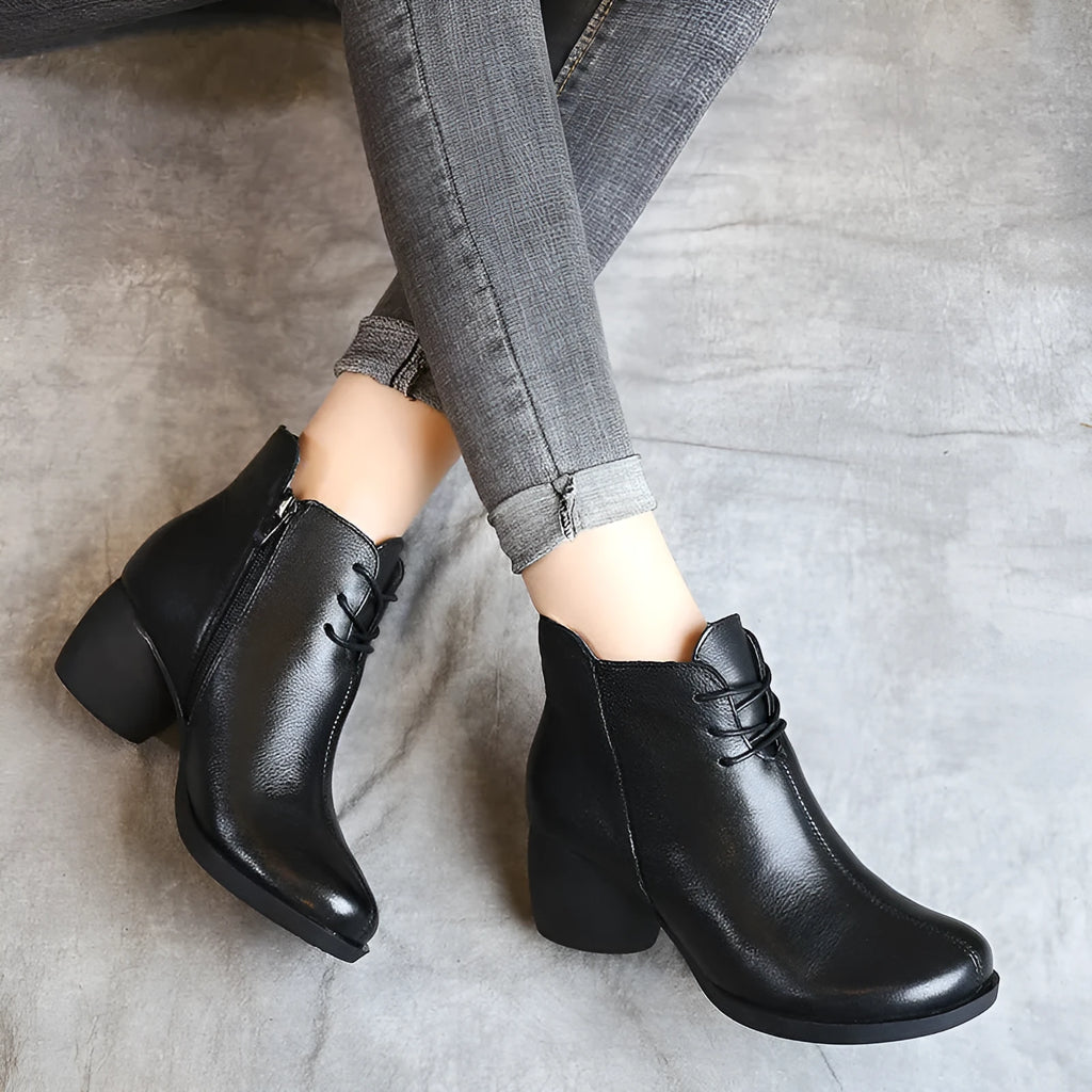 Women's brown leather Martin boots with a thick round heel and round toe.