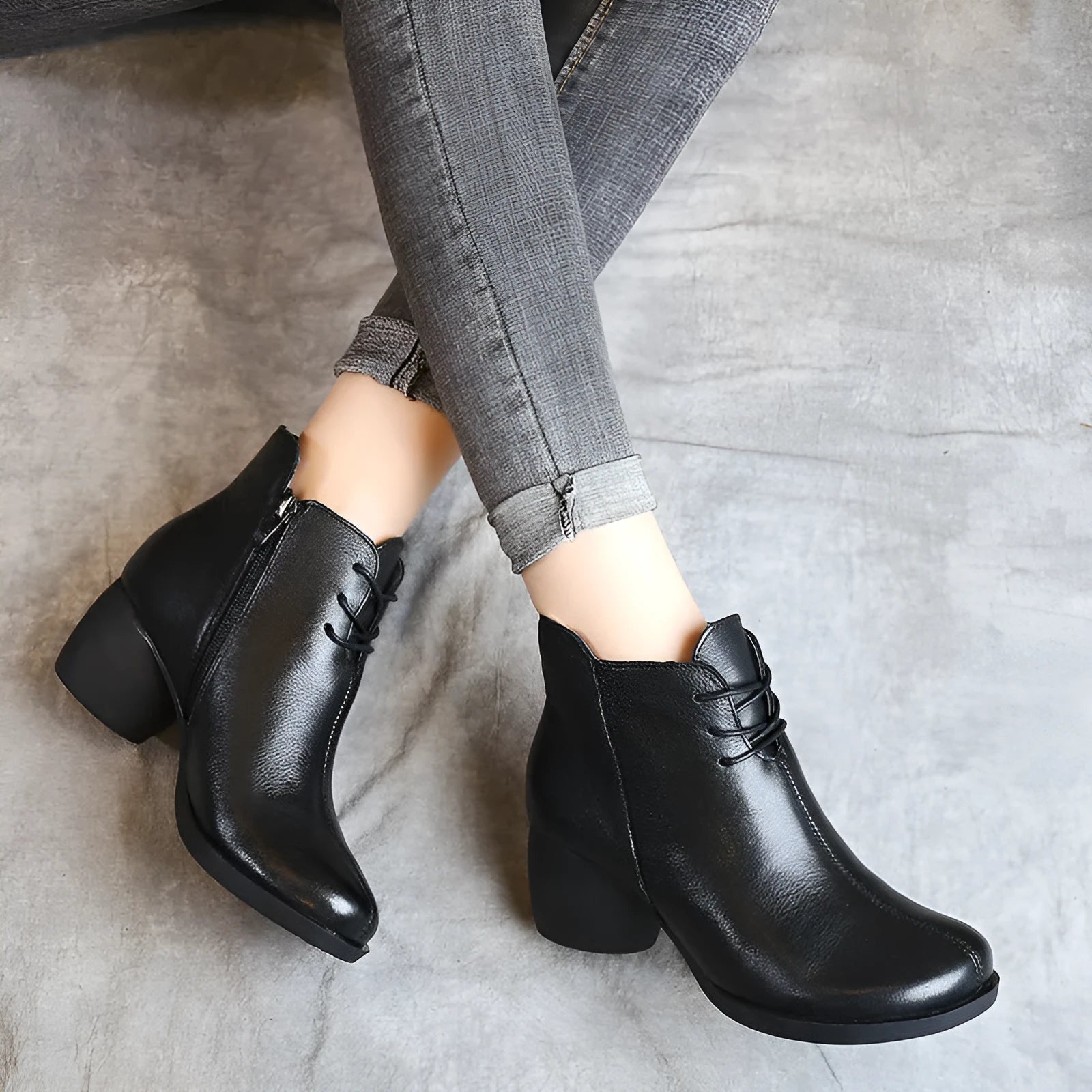 Women's brown leather Martin boots with a thick round heel and round toe.
