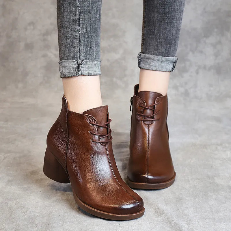 Women's brown leather Martin boots with a thick round heel and round toe.