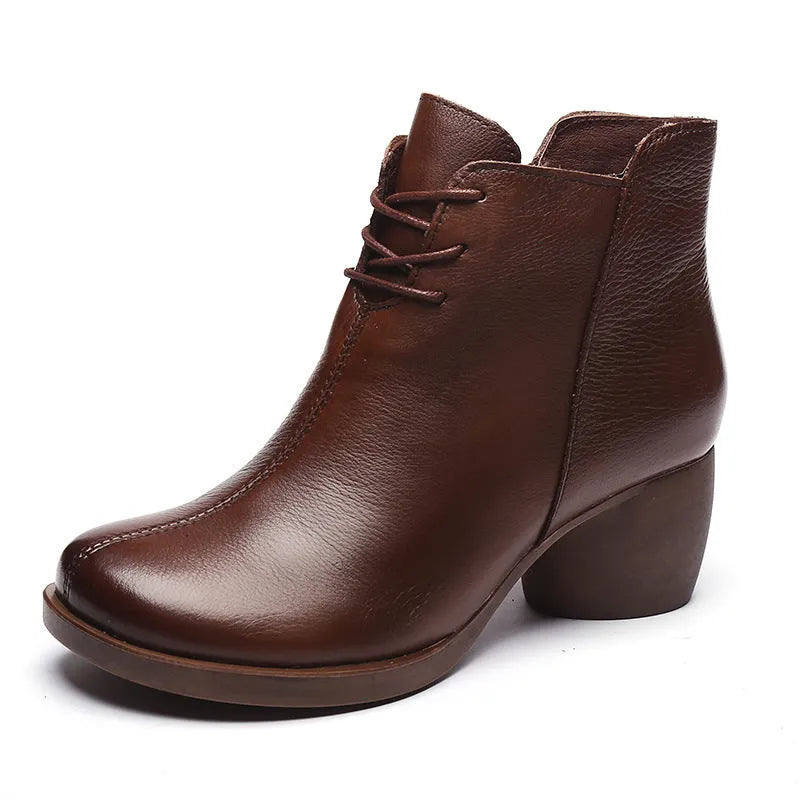 Women's brown leather Martin boots with a thick round heel and round toe.