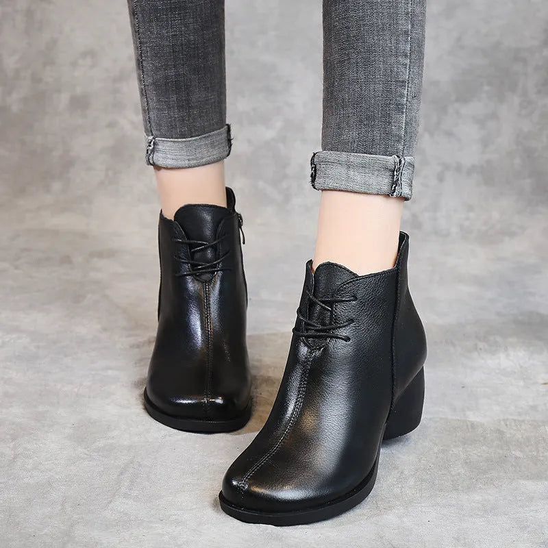 Women's brown leather Martin boots with a thick round heel and round toe.