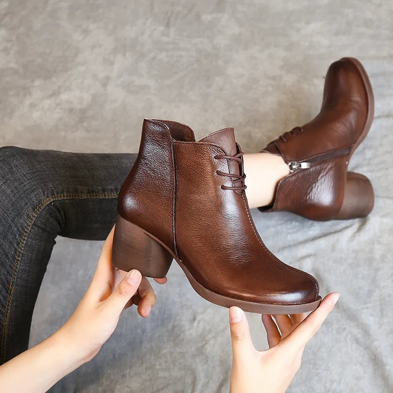 Women's brown leather Martin boots with a thick round heel and round toe.