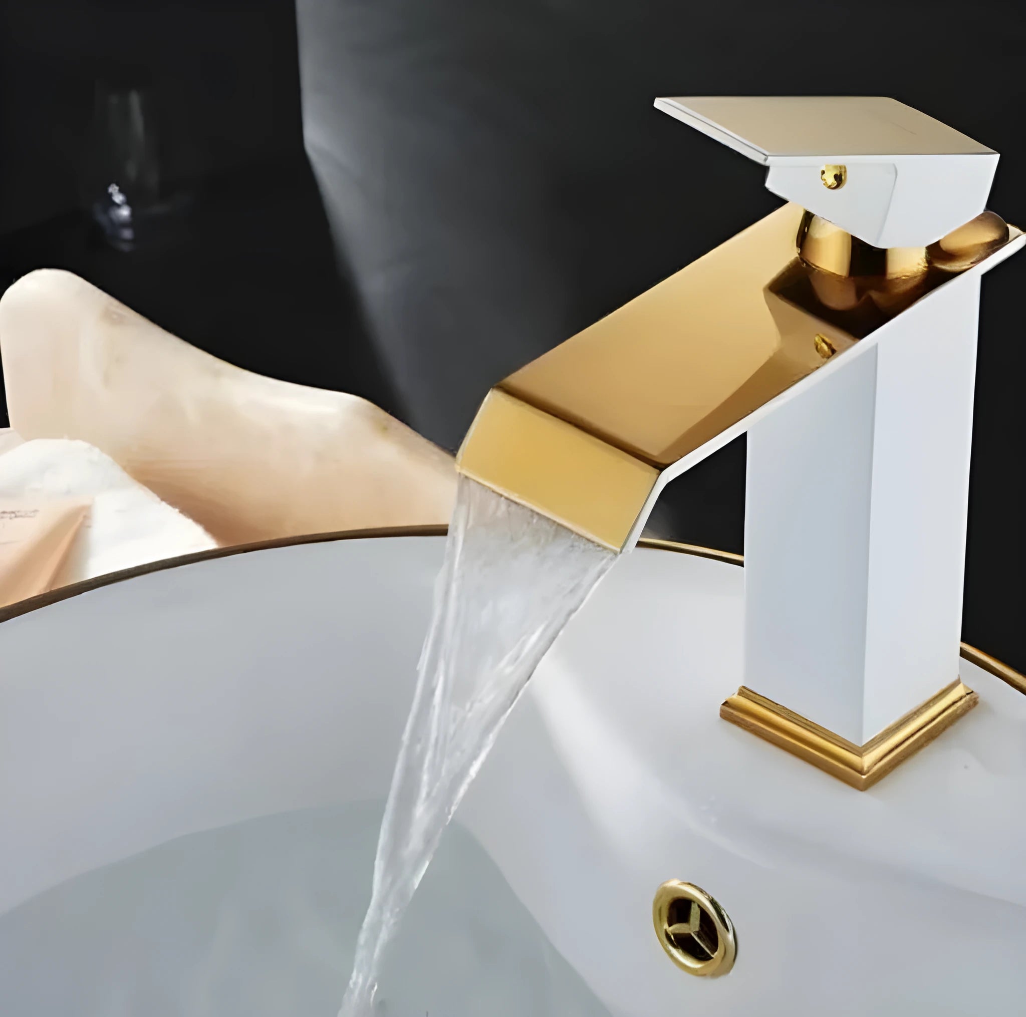 Black and white gold finished brass waterfall basin faucet with electric induction sensor.