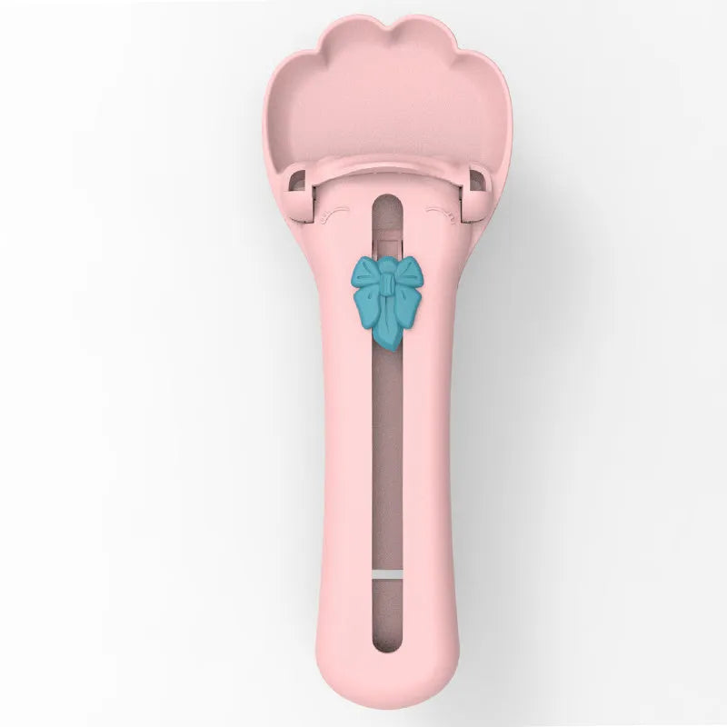 Green and pink squeezable pet food dispenser spoon for cats and dogs