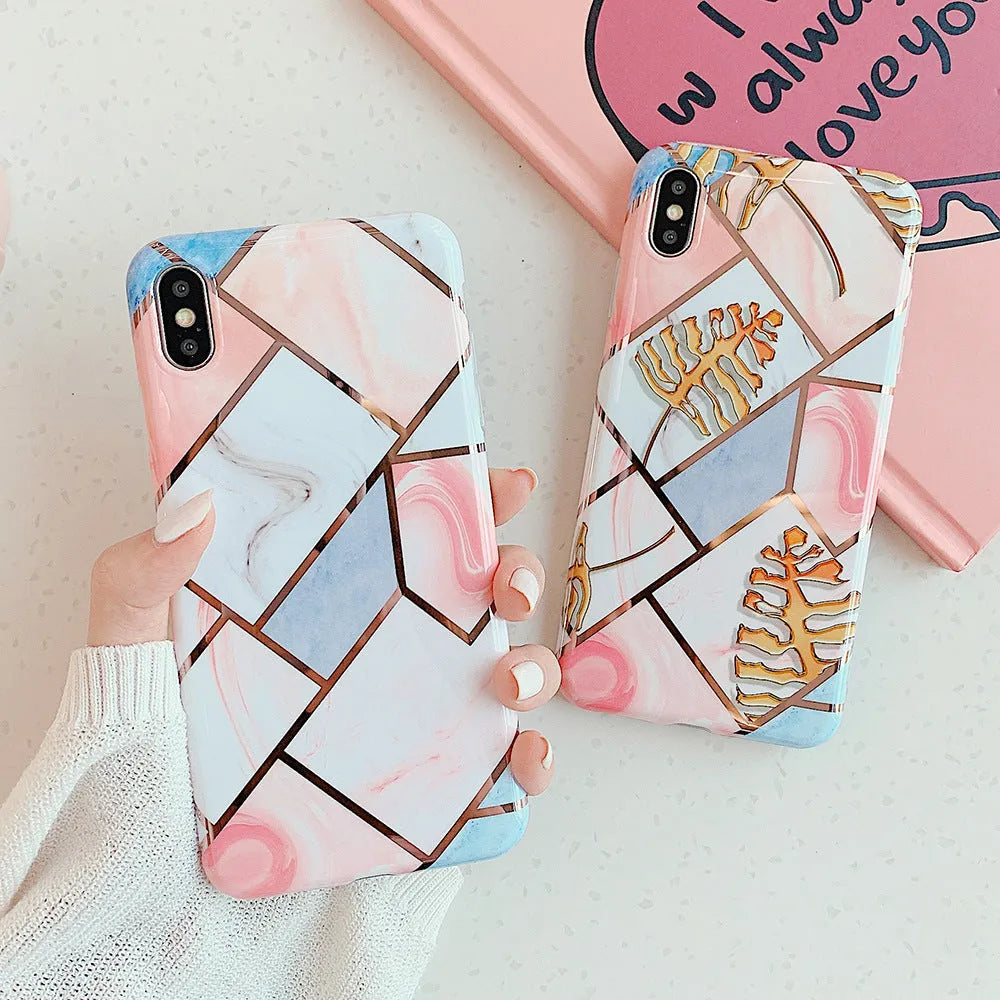 Flexible silicone gel mobile phone case for various iPhone models on a table.