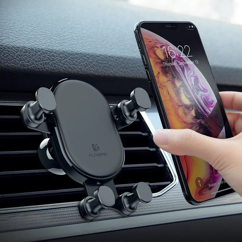 Black gravity car phone holder showing 360-degree rotation mechanism