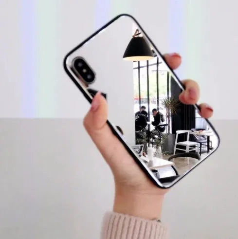 Black iPhone case with a reflective mirror surface on the back, compatible with iPhone 7, 8 Plus, and X models.