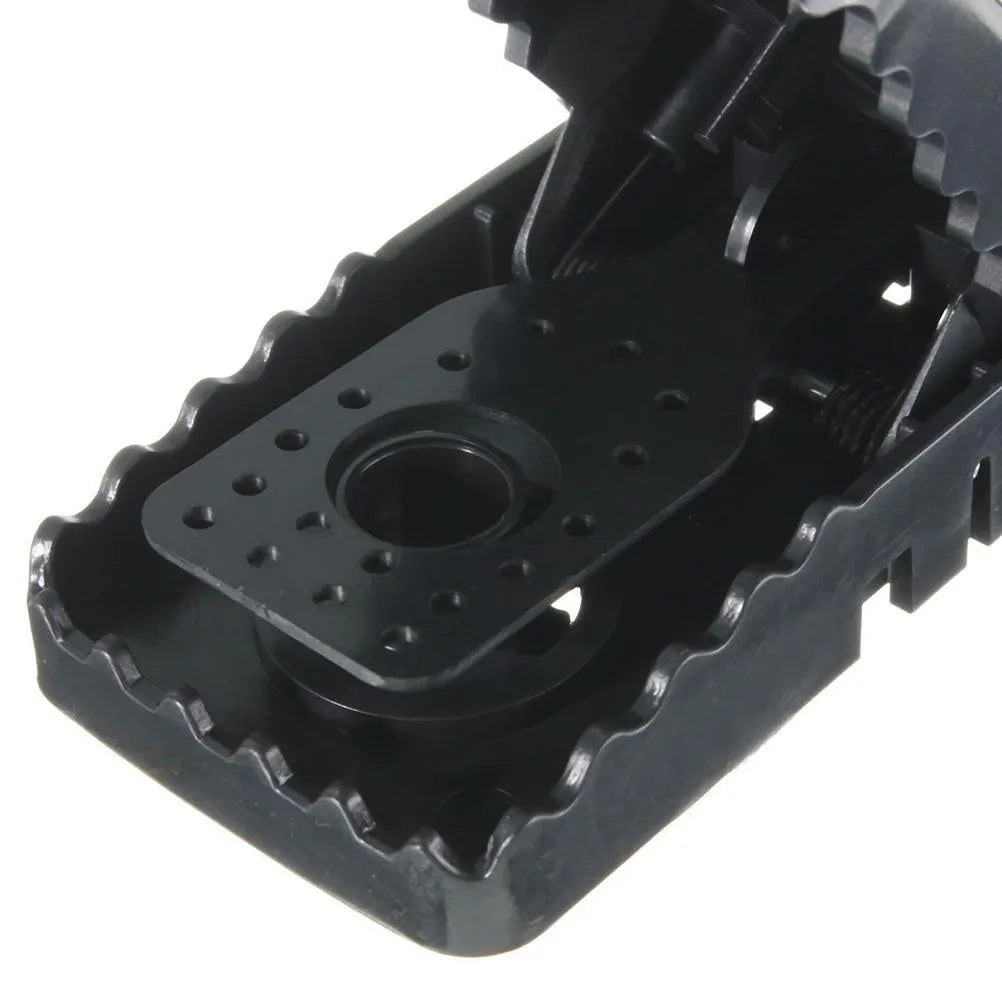 Six black snapping mousetraps showing PC+ABS plastic construction and bite-type mechanism