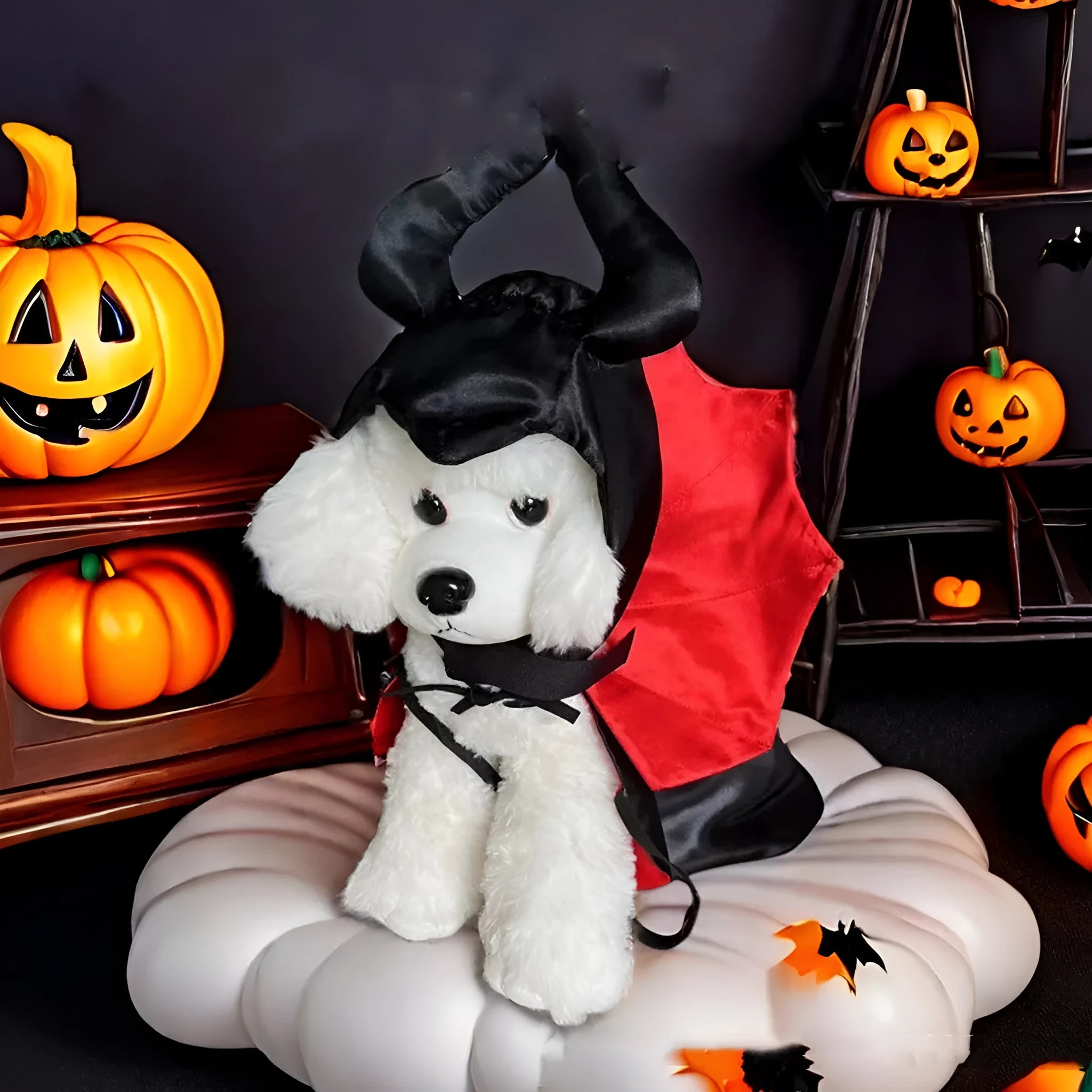 Red Halloween devil cloak and matching pointed hat for a small dog on a white background.