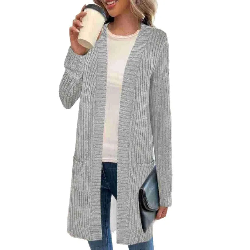 Long sleeve loose-fit knitted cardigan jacket with pockets in wine red colour.