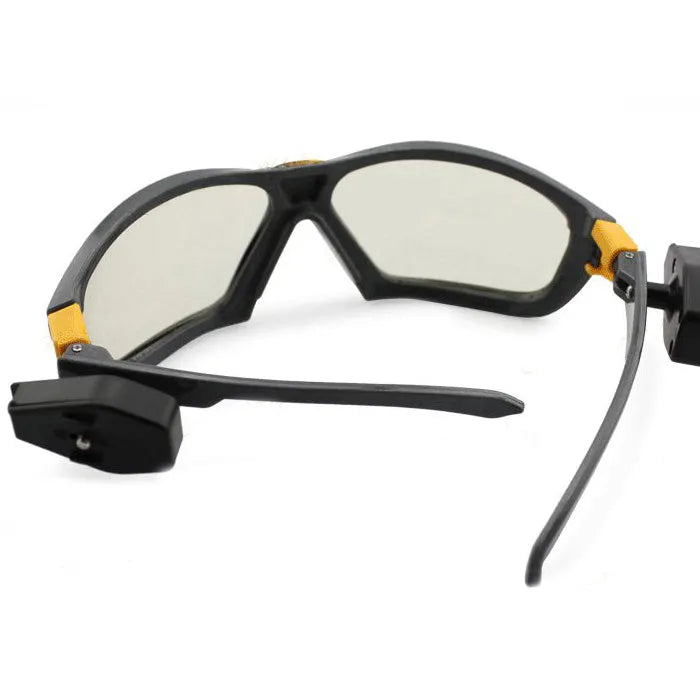 Yile anti impact goggles with LED lamp on a workbench showing protective eyewear and integrated light
