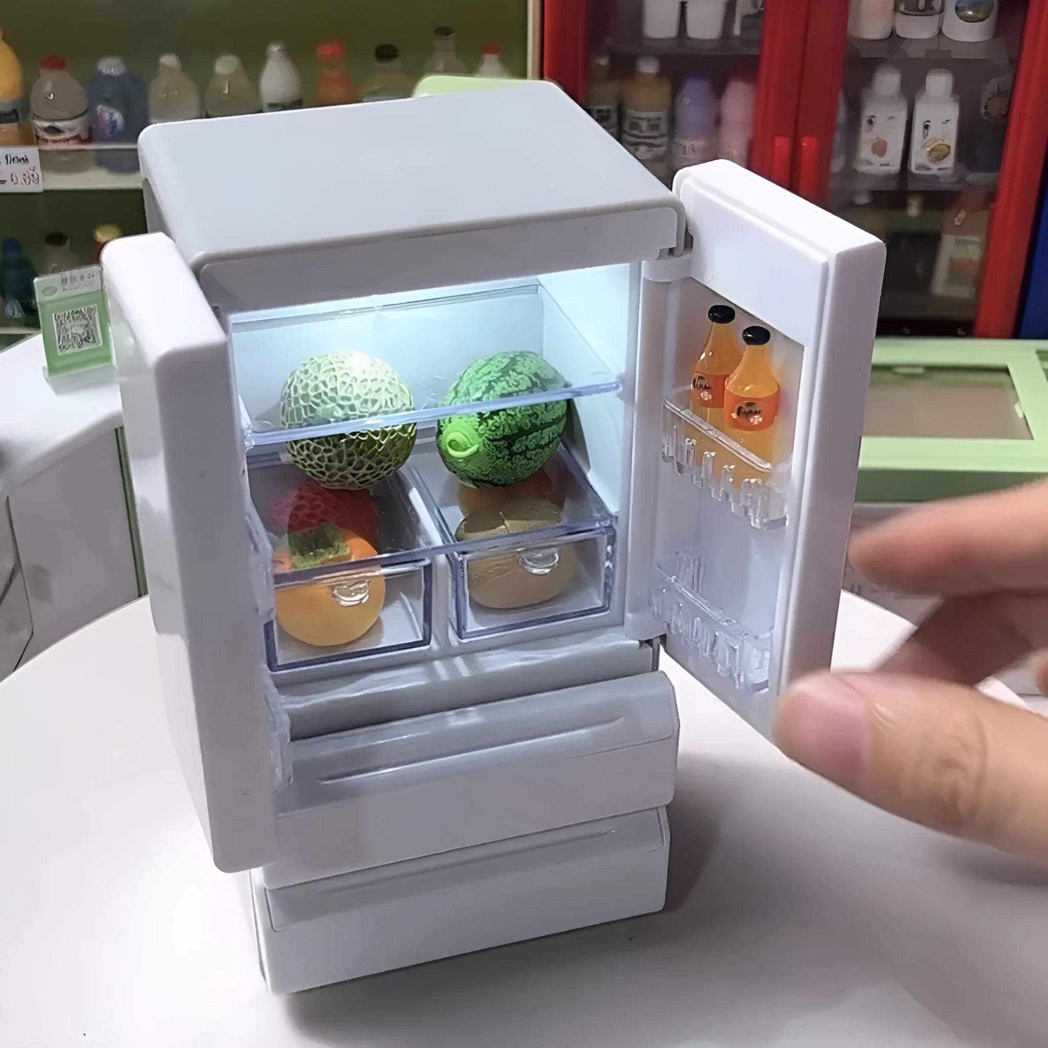 Small white plastic miniature model with internal LED light on, showing dimensions of 11.4cm height.