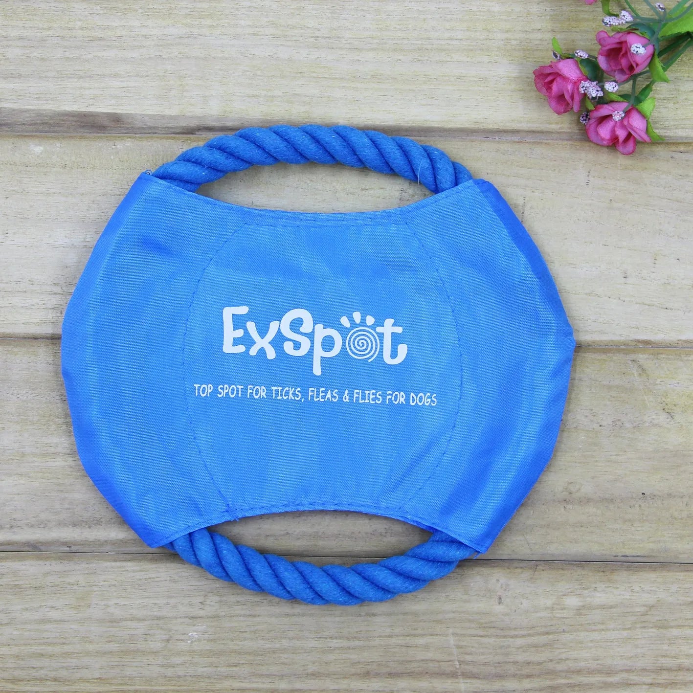 Canvas and rope dog flying disc toy with rain silk surface, 19cm diameter, on grass