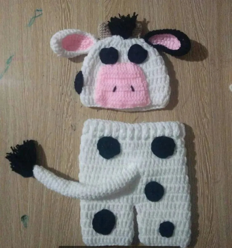 White hand-knitted baby cow suit set with hat and pants made from wool cotton blend