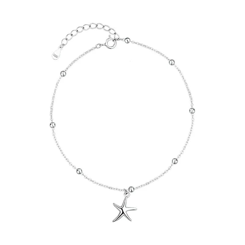 S925 sterling silver adjustable starfish anklet with round beads on an ankle, showing the 1.2 cm charm detail.