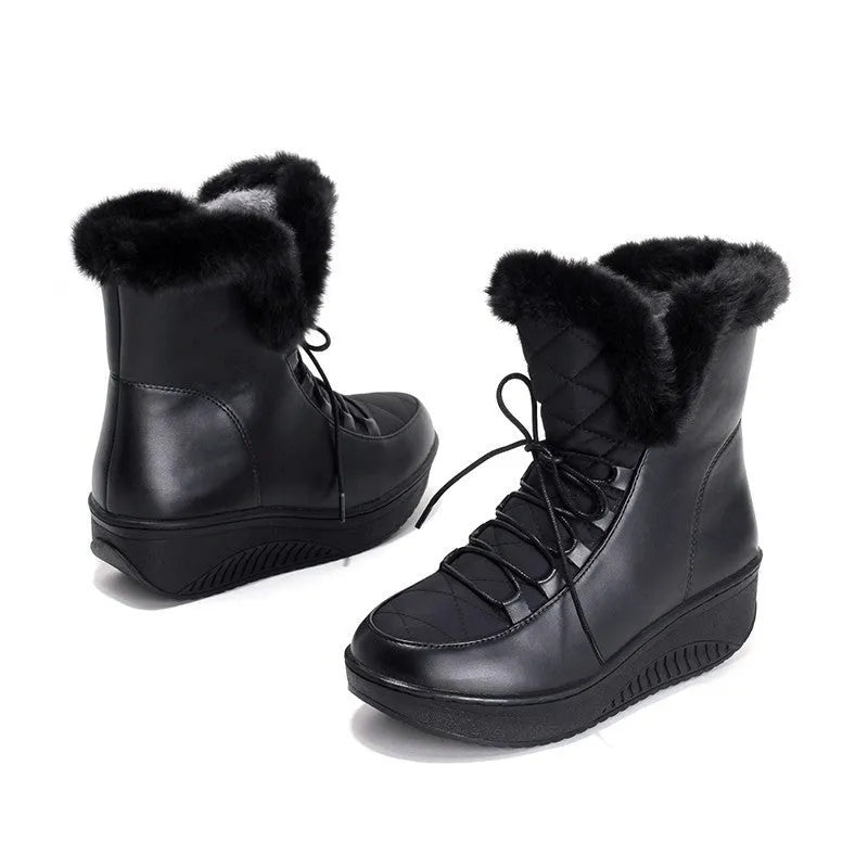Black women's lace-up winter boots with a platform sole on a neutral background.