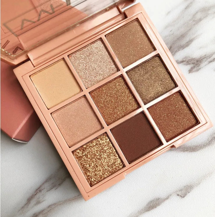 Nine-colour eyeshadow palette with warm brown, charred orange, and nude matte and pearlescent shades