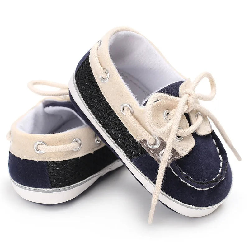 Baby soft bottom toddler shoes in beige with mesh upper and non-slip sole on a white background