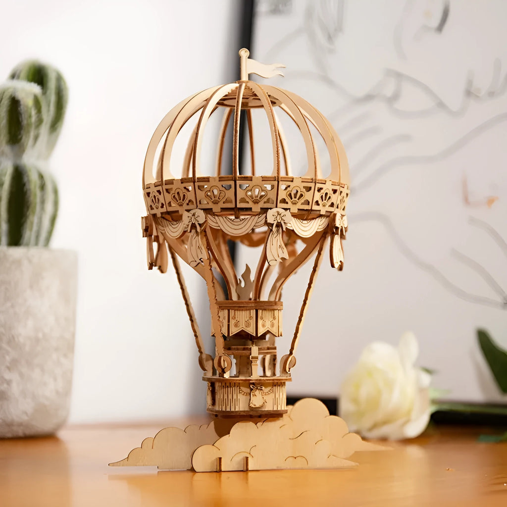 Wooden 3D puzzle model of a radio assembled from pre-cut wood pieces on a white background