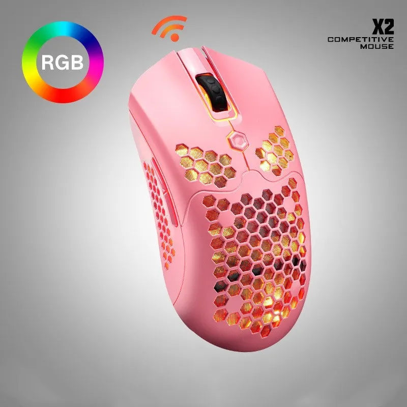 Free Wolf X2 wireless gaming mouse in black on a mouse mat, showing RGB lighting and USB-C cable.